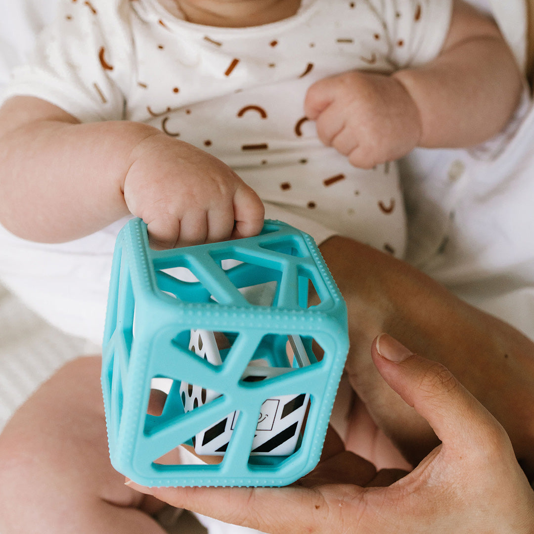 Blue chew cube and rattle for babies