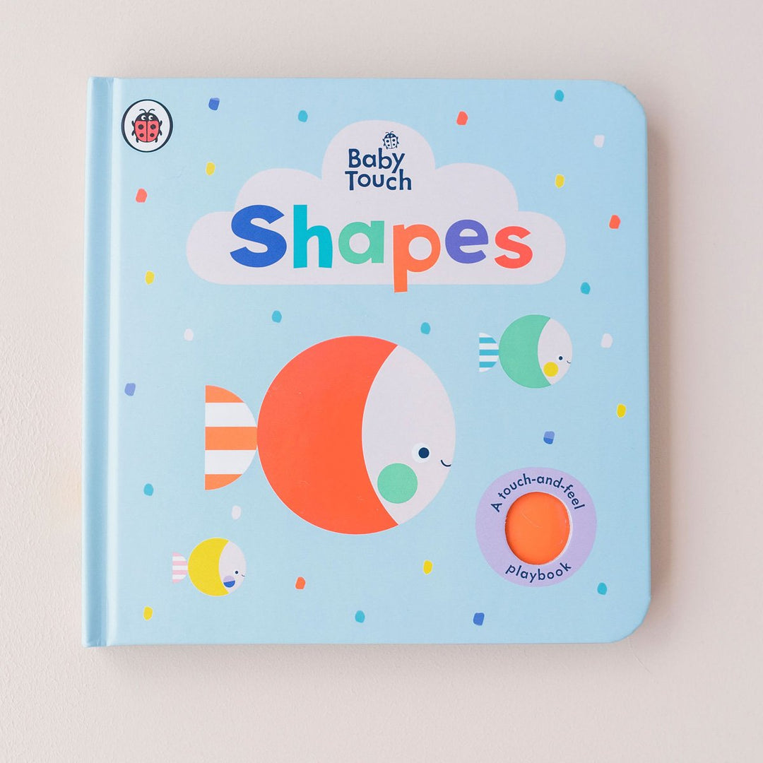 Educational babies Shapes Book with blue cover.