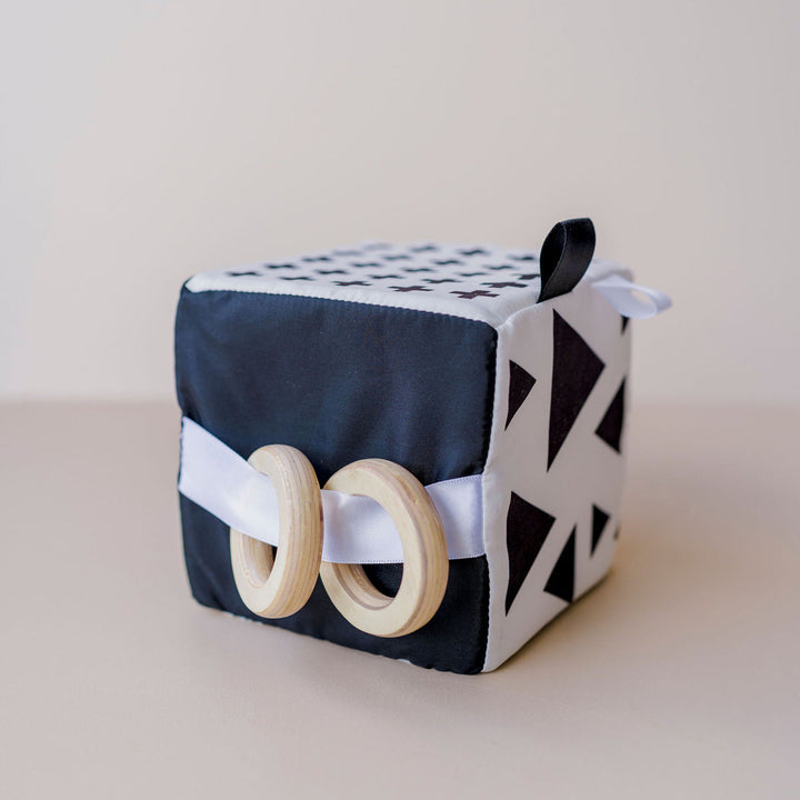 Sensory Cube toy for babies with black and white features.
